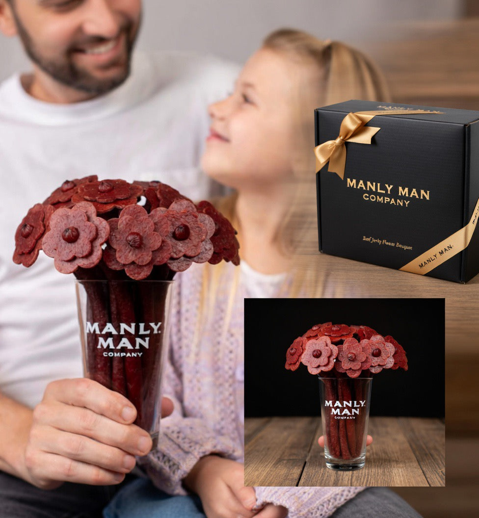 Manly Man Company product with a man and child, including a box and a glass with red flower-shaped objects.