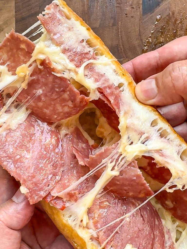 Artisanal gourmet salami and melted cheese sandwich on crusty bread