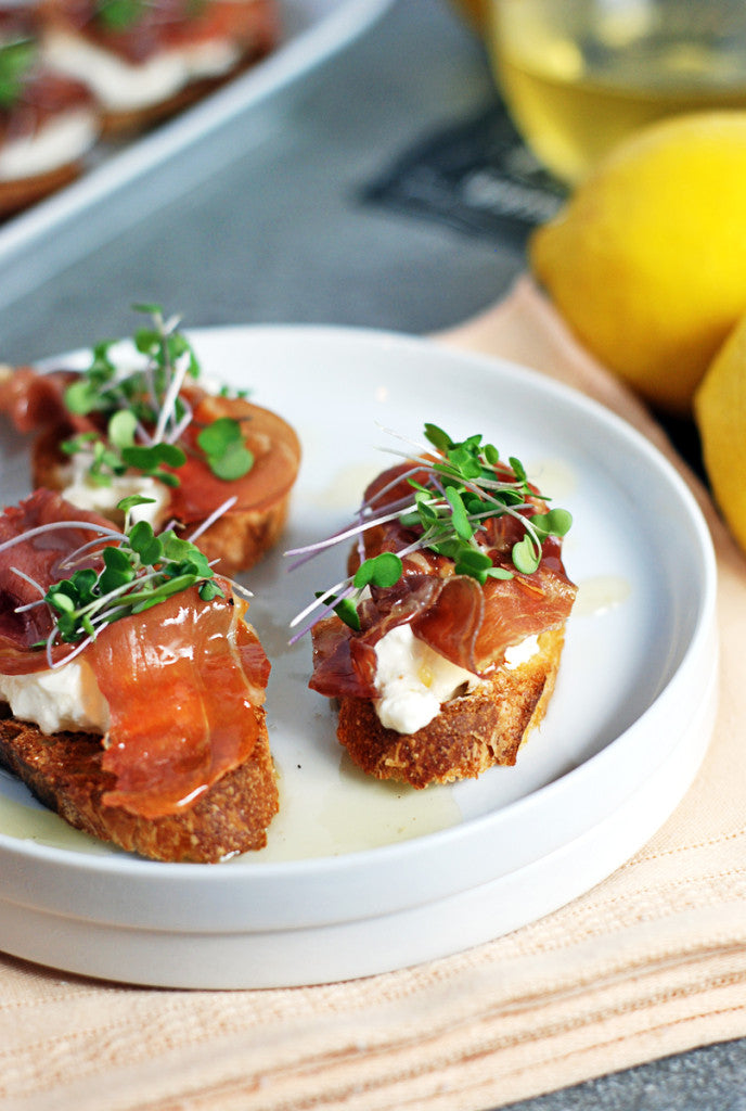 PROSCIUTTO CROSTINI WITH BURRATA AND LEMON HONEY DRIZZLE