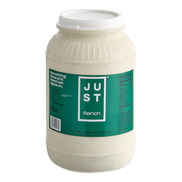 A large white plastic tub of Just Ranch Plant Based Dressing on a solid white background.