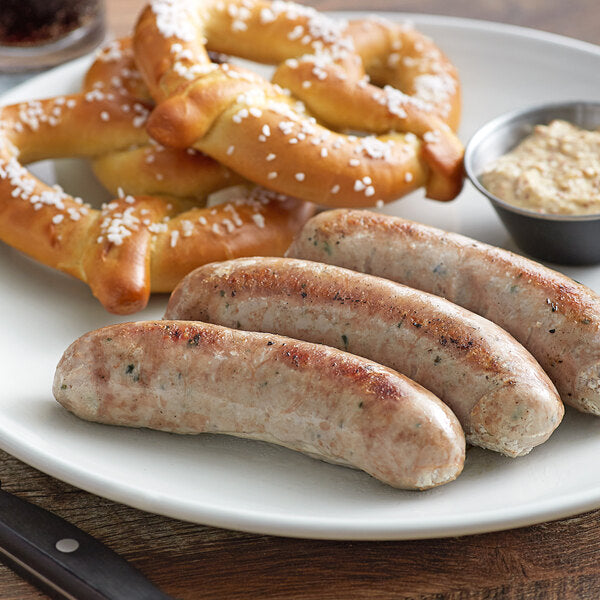 Three browned sausages served with salted pretzels and a small bowl of mustard
