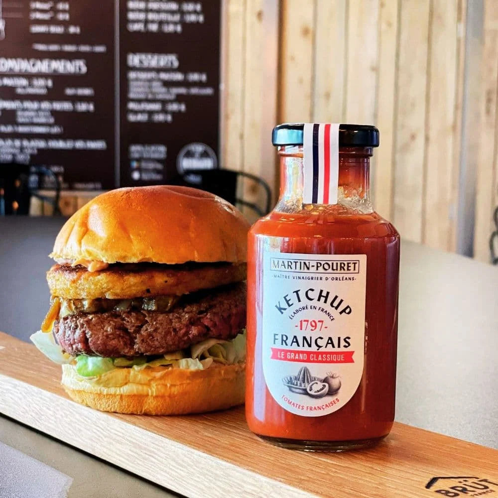 Martin Pouret Le Grand Classique French Ketchup bottle beside a burger
