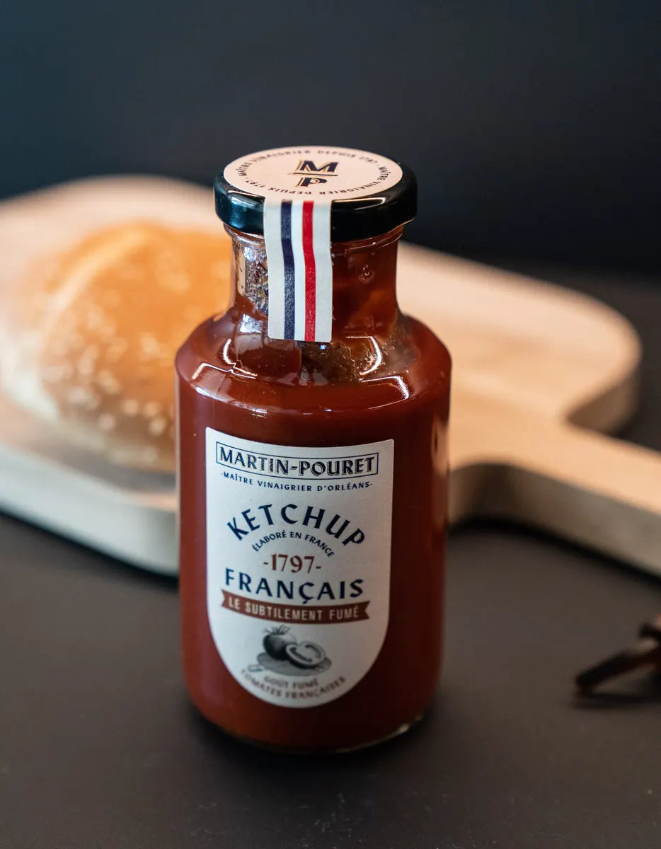 Martin Pouret Le Subtilement Fumé smoked French ketchup bottle on a cutting board
