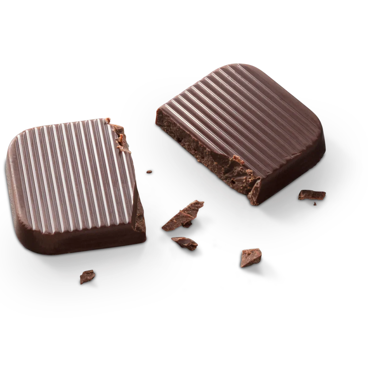  two broken chocolate pieces: Two ridged Bouchard dark chocolate pieces with broken edges and scattered chocolate crumbs