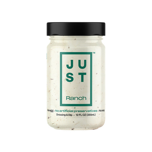 A glass jar of Just Ranch Dressing & Dip with a black lid and a white contents, featuring a green and black label on a solid white background.