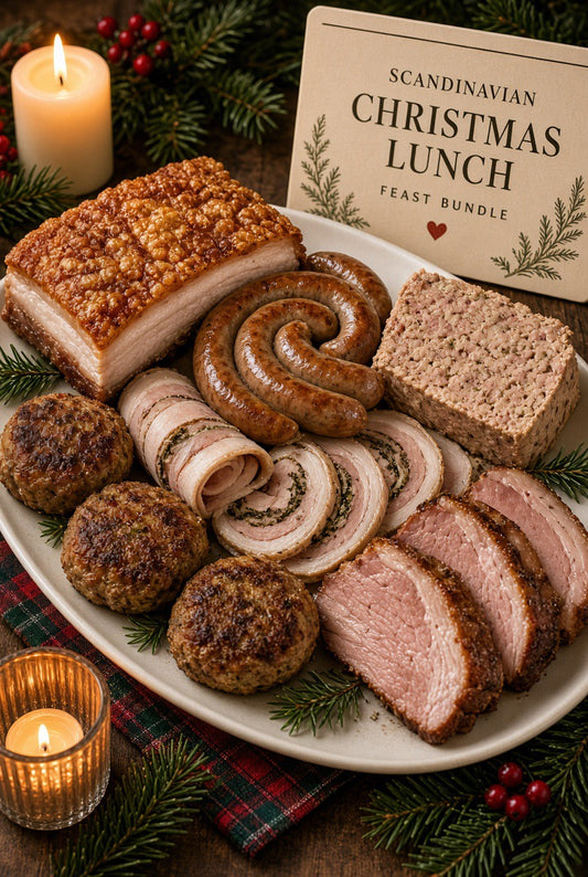 Scandinavian Christmas lunch platter with roast pork, spiral sausage, pâté, rolled pork, and meatballs.