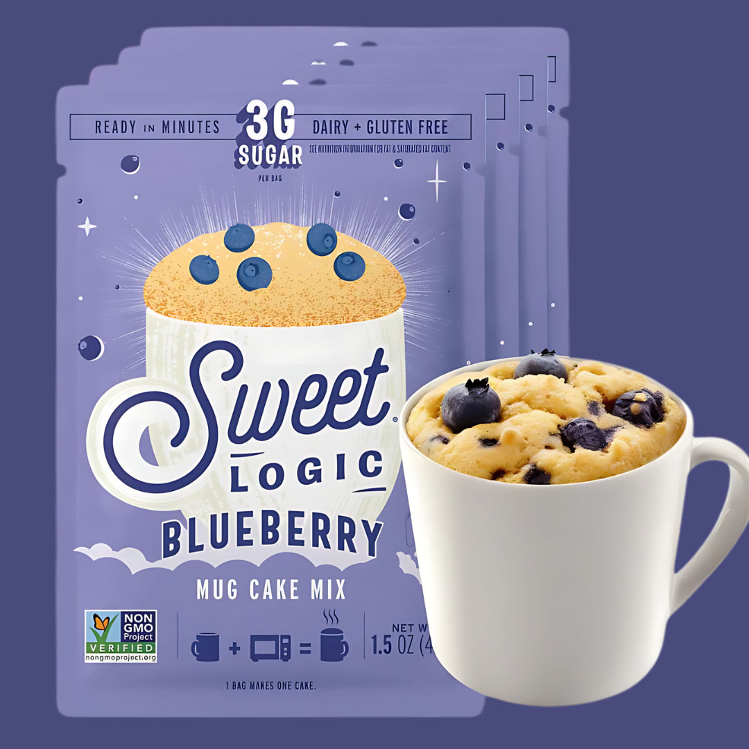 Sweet Logic Blueberry Mug Cake Mix packaging with a prepared mug cake on a purple background