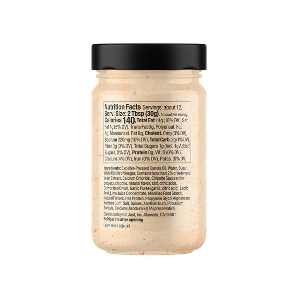 Back side of a clear plastic jar of Mediterranean Flakes seasoning with a black lid, showing the detailed nutrition facts label on a white background.