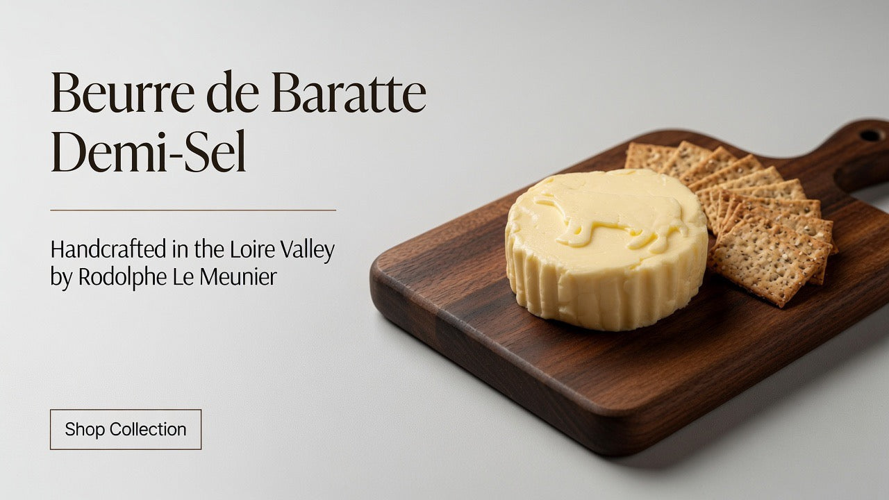 Rodolphe Le Meunier Beurre de Baratte demi-sel butter round on wooden board with crackers, handcrafted in the Loire Valley