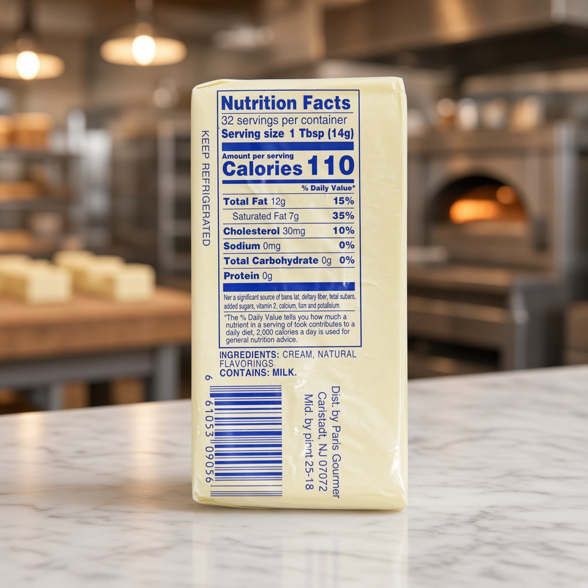 A cream-colored block of cheese standing upright on a marble countertop, showing the Nutrition Facts label on the side. The background is a softly blurred restaurant or cafe interior with warm lighting.