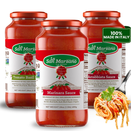 Four jars of La San Marzano pasta sauce arranged in a studio-style product shot, with the front jar labeled Marinara Sauce and a green '100% Made in Italy' badge on the right. A fork with spaghetti and cheese appears at the lower right as a serving suggestion.