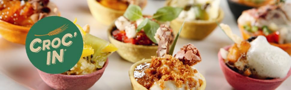A close-up promotional shot of several small crocodile appetizers served in shallow bowls, with a green circular logo reading CROC'IN overlaid on the left side.