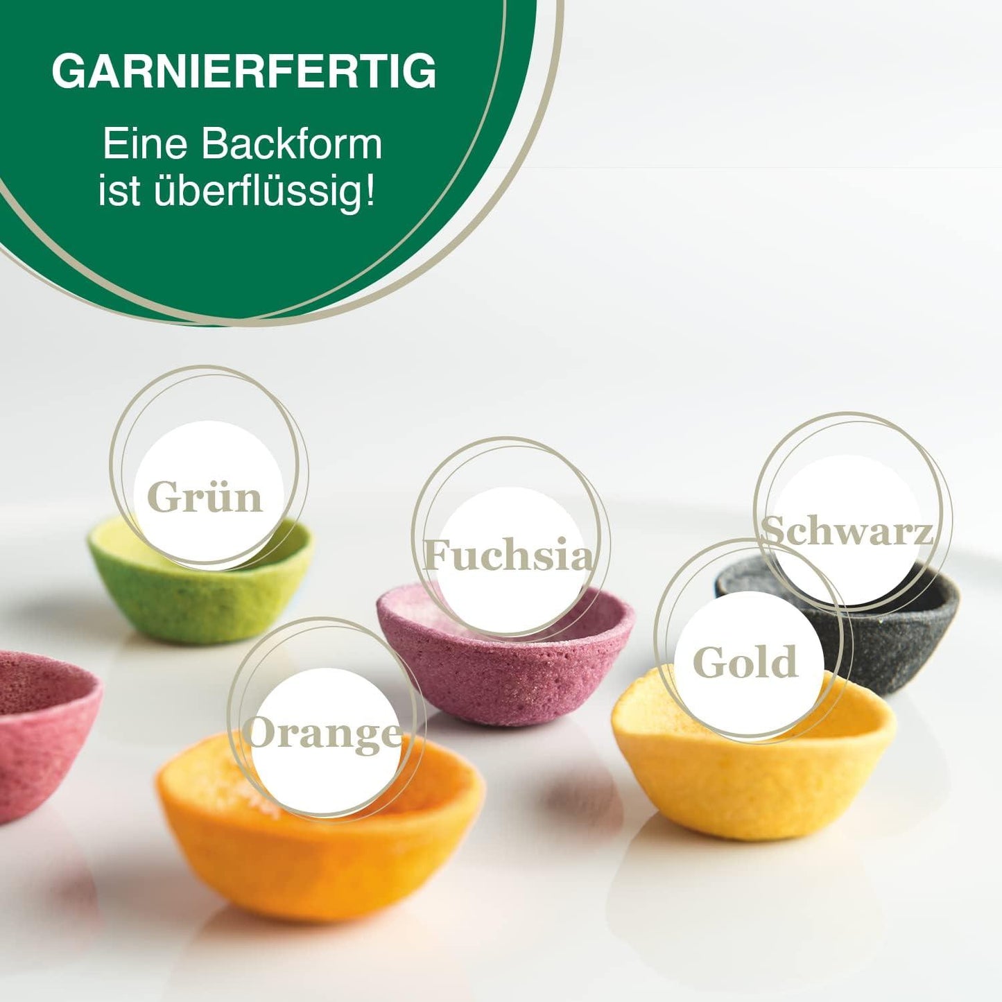 Six small felt garnishing bowls in different colors are arranged on a white surface with German text labels: Grün, Fuchsia, Schwarz, Orange, Gold, and a pink bowl partially visible at left. A green circular badge at the top left reads 'GARNIERFERTIG' and 'Eine Backform ist ürflässig!'.