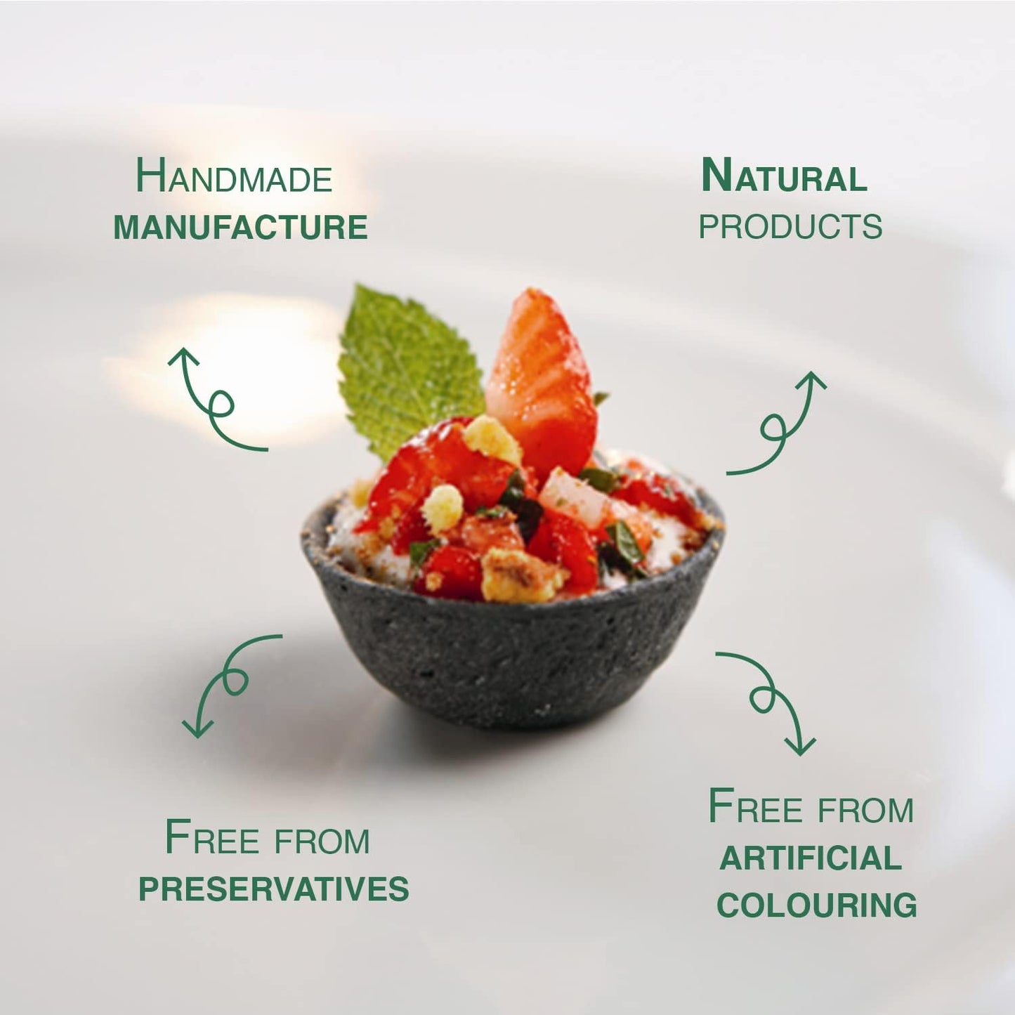 Bowl of salad with text highlighting 'Handmade Manufacture', 'Natural Products', 'Free from Preservatives', and 'Free from Artificial Colouring'.