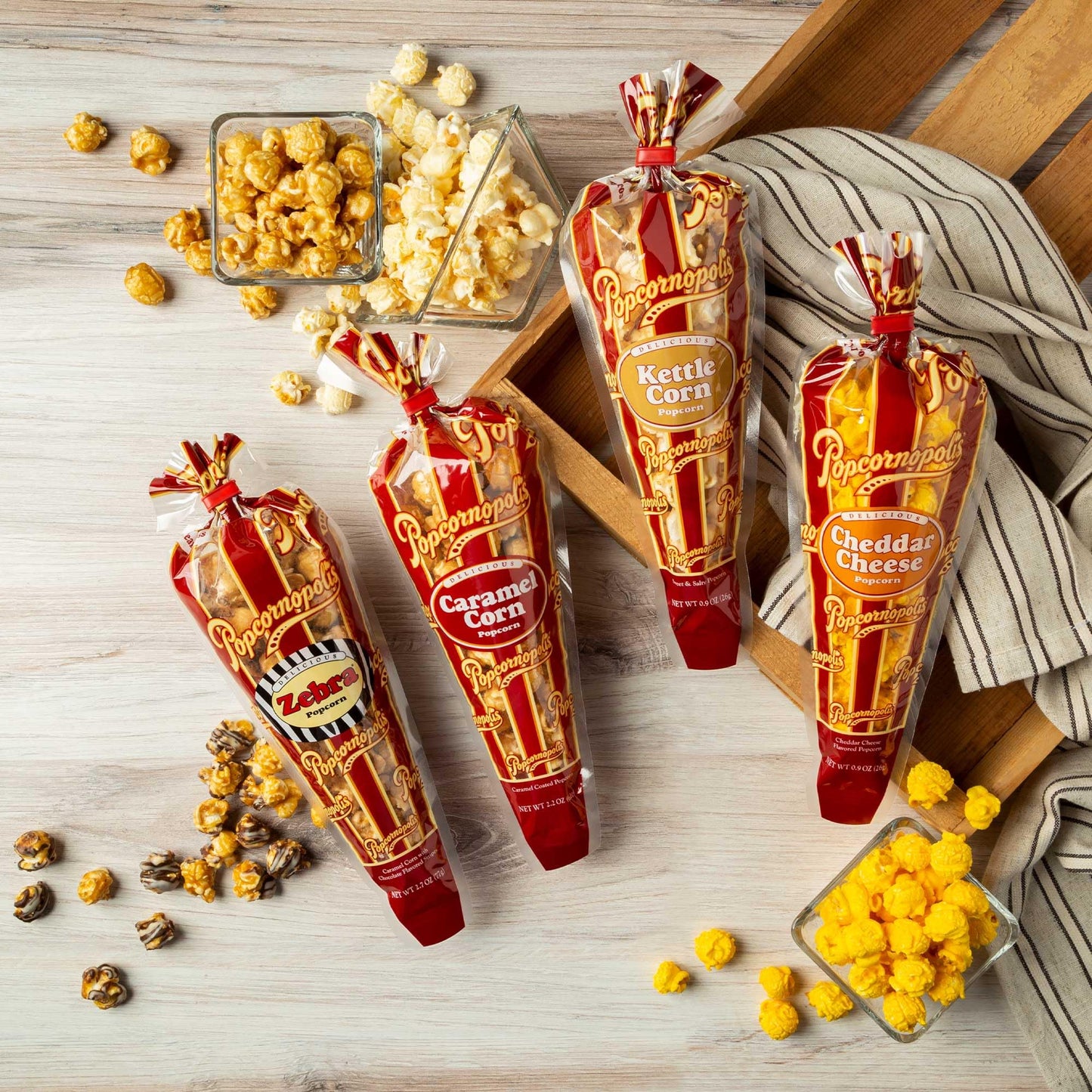 Popcornopolis Gourmet Popcorn Snacks, 40 Cone Variety Gift Cones / 0.9 - 2.7 oz - Assorted Flavored Mixed Indulgent Popcorn – (10) 0.9oz Kettle Mini Cones, (10) 0.9oz Cheddar Mini Cones, (10) 2.2oz Caramel Corn Mini Cones, (10) 2.7oz Zebra Mini Cones