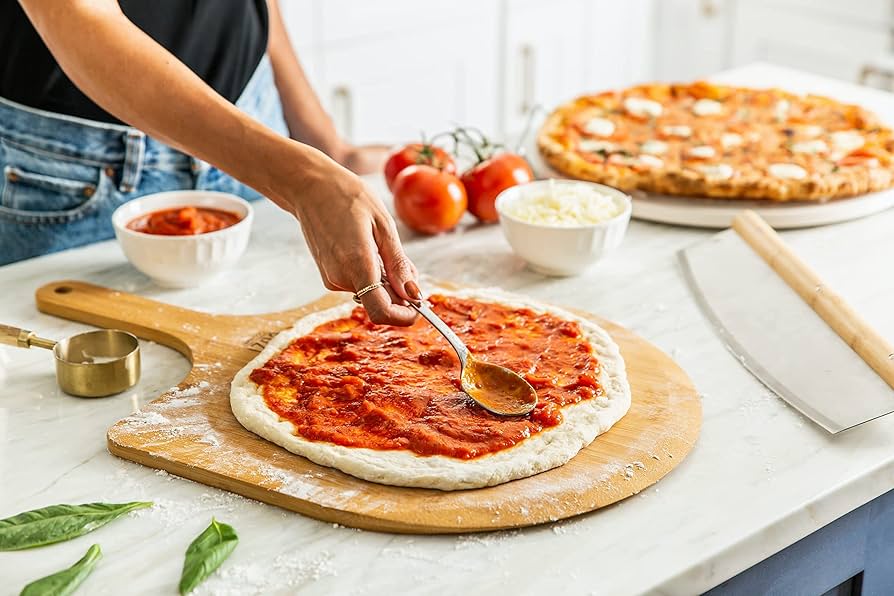 Cuzi Gourmet XL - 4 Piece Pizza Stone Set - 15" Thermal Shock Resistant Cordierite Baking Stone, 22" Natural Bamboo Peel & Cutter Rocker - Large Stone for Grill and Oven