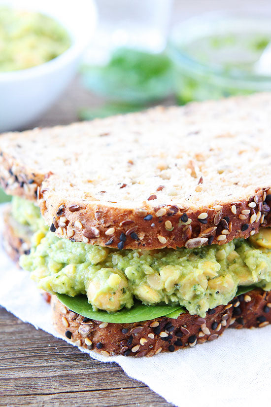 SMASHED CHICKPEA, AVOCADO AND PESTO SALAD SANDWICH