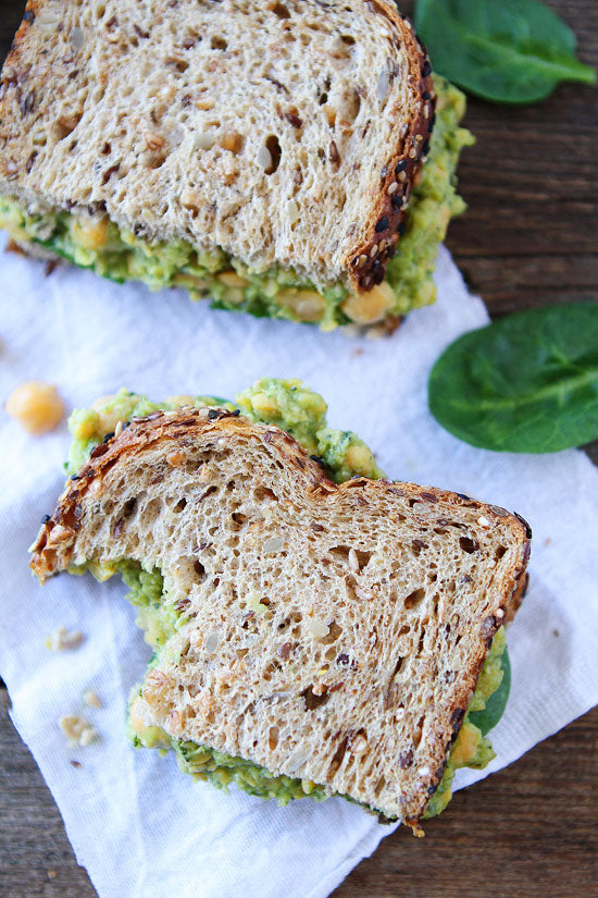 SMASHED CHICKPEA, AVOCADO AND PESTO SALAD SANDWICH