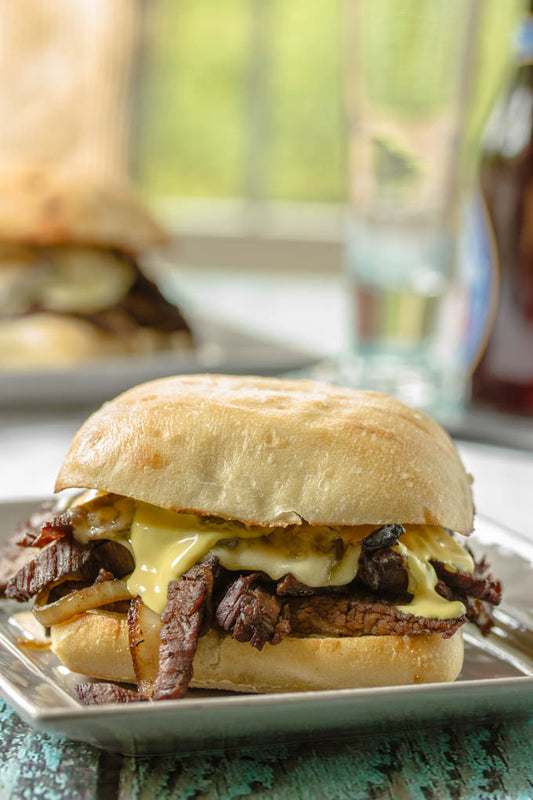 STEAK SANDWICH WITH ONIONS, MUSHROOMS, HAVARTI & AVOCADO