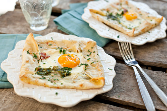 BAKED GREEN EGGS WITH PROSCIUTTO AND PESTO