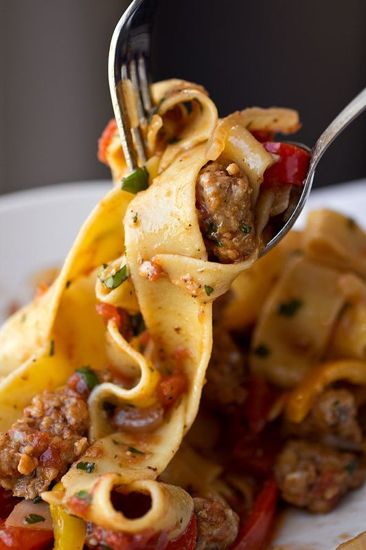 Saucy, Italian “Drunken” Noodles w/ Spicy Italian Sausage, Tomatoes, Caramelized Onions, Peppers - 2 lbs