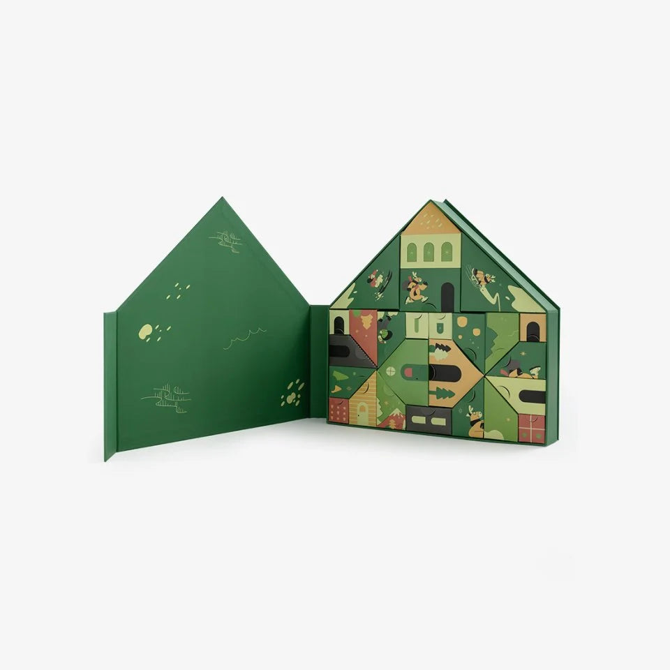 Open Läderach Advent Calendar House showing illustrated individual boxes fitted inside the green case
