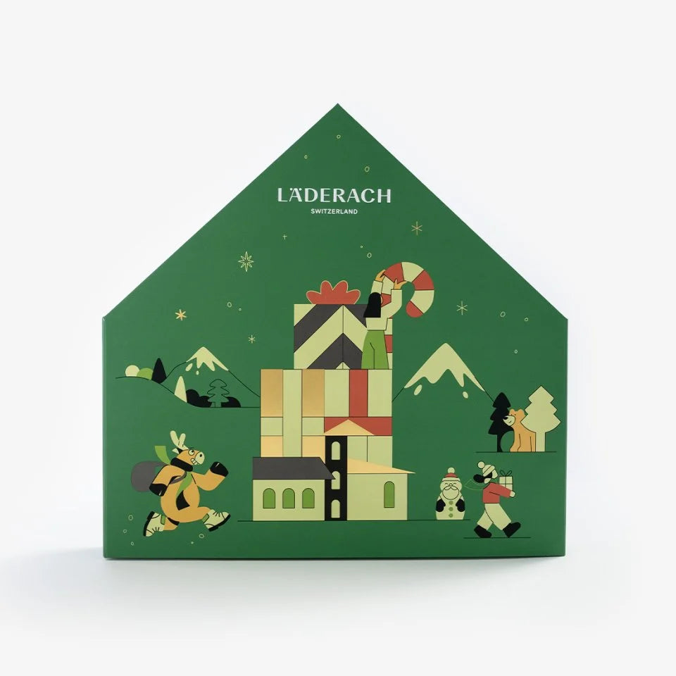 Front of the green Läderach Advent Calendar House with illustrated buildings and festive characters
