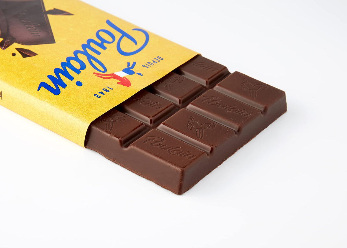 Bar sliding out of yellow wrapper on white background, showing embossed Poulain logo — Depuis 1848
