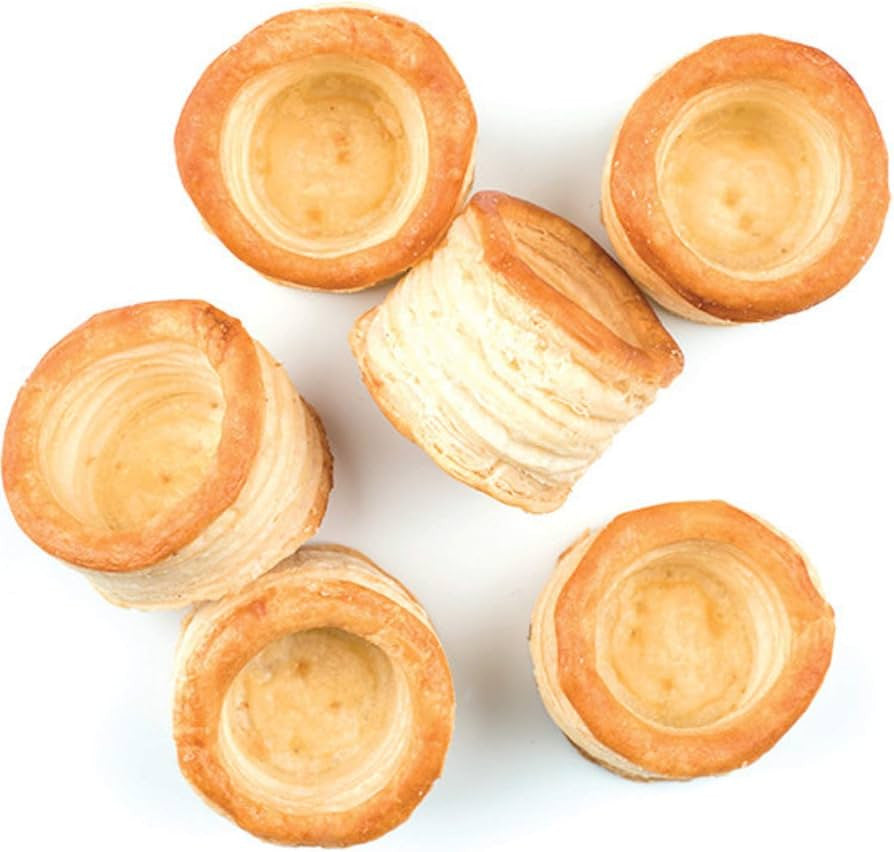 Five mini golden-brown pastry cups arranged on a plain white background.