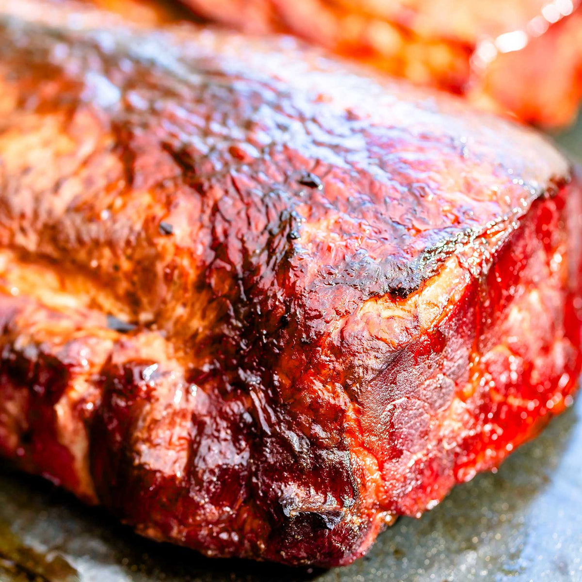 Close-up of a grilled meat dish with a focus on texture and color.