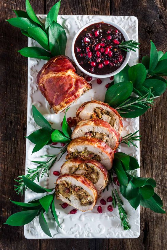 PROSCIUTTO WRAPPED TURKEY ROULADE WITH POMEGRANATE-PORT REDUCTION SAUCE